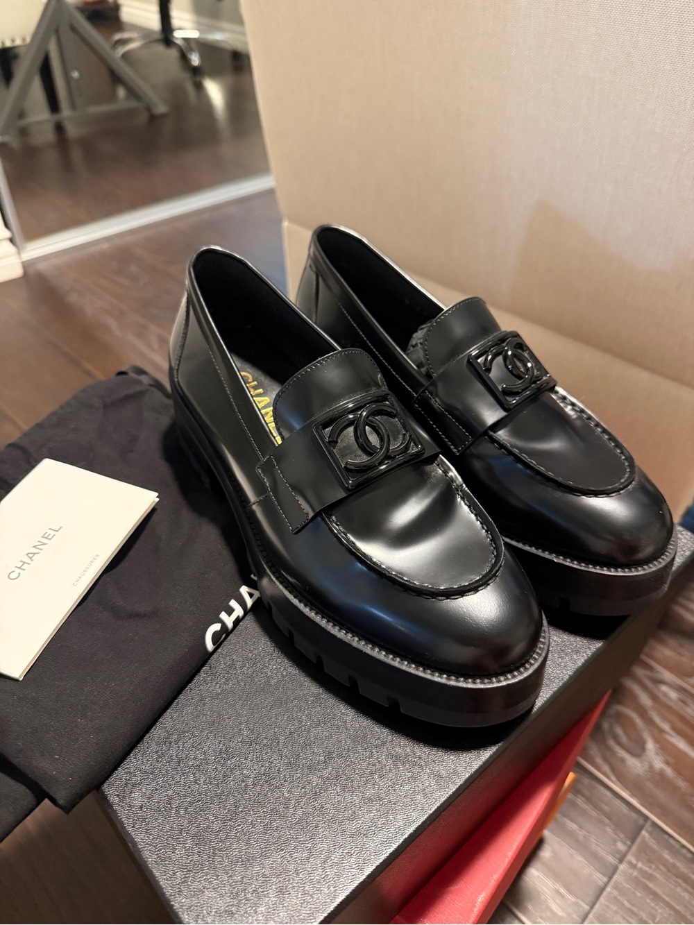 CHANEL Black on Black CC buckle loafers